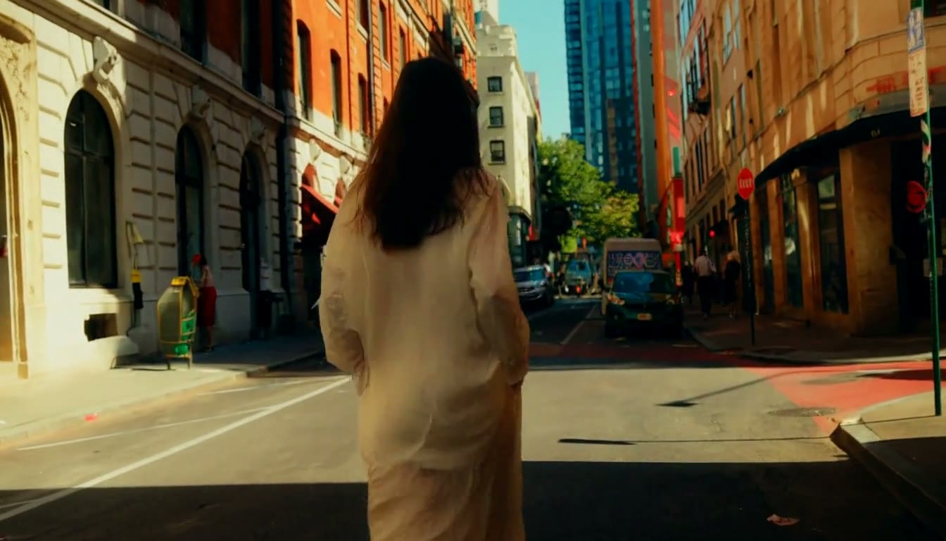 MiniMax H3 AI video example showing a woman confidently walks down a city street, her outfit catching the sunlight