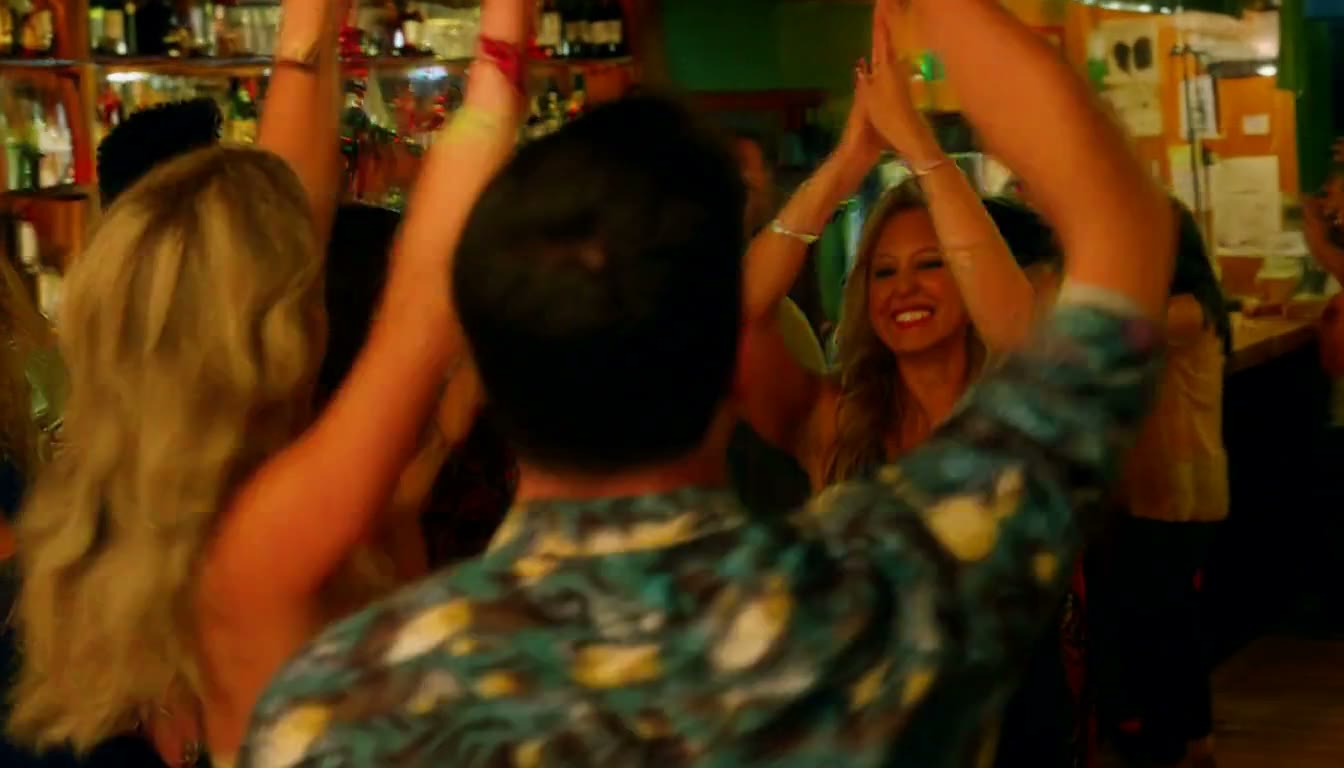 MiniMax H3 AI video example showing a group of people celebrating in a lively bar setting