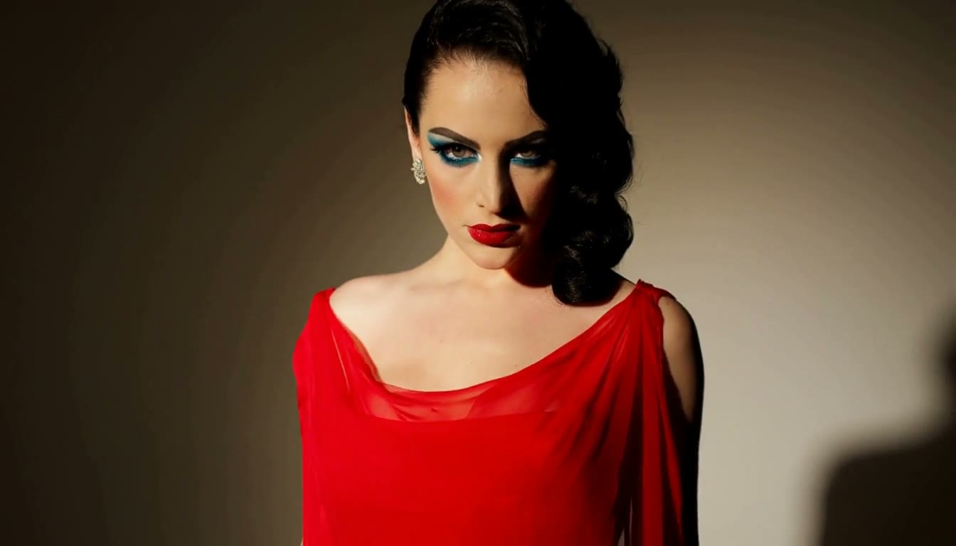 MiniMax H3 AI video example showing a woman with dramatic makeup and a vintage hairstyle is featured in a video with a mysterious and intense atmosphere
